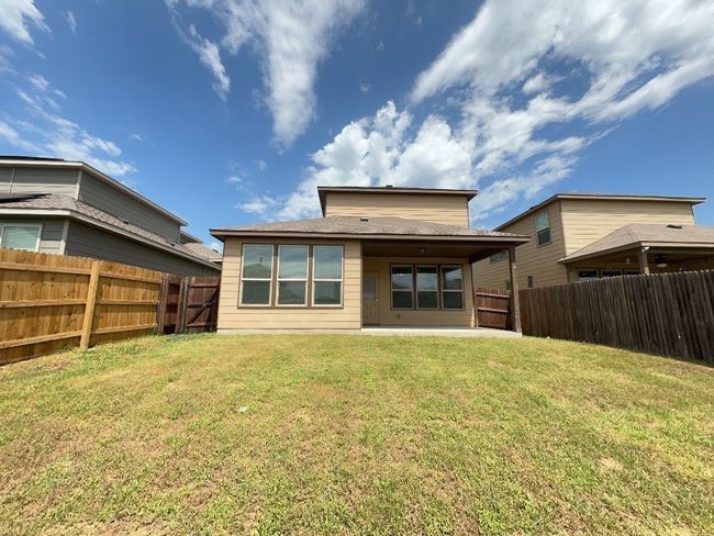 Rear view of property featuring a fenced backyard and a patio | Image 22