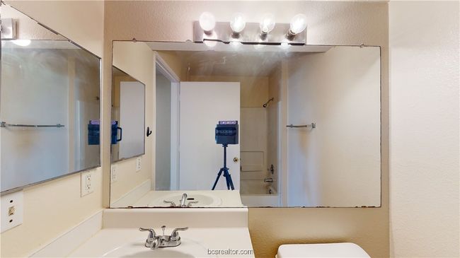 Full bathroom featuring toilet, sink, and bathing tub / shower combination | Image 16