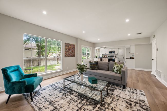 Open and bright with recessed lighting, large windows, and modern finishes. | Image 19