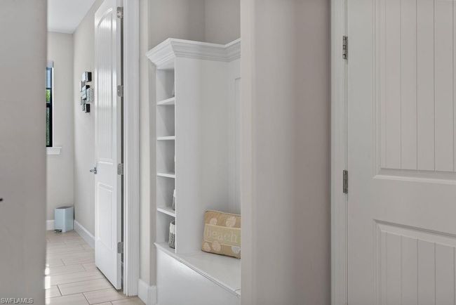 Hallway featuring wood finish floors and baseboards | Image 15