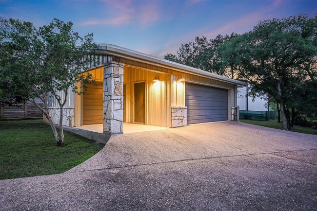 The 2 car/1 golf cart garage is spacious enough for multiple vehicles and includes additional storage space for outdoor gear | Image 20