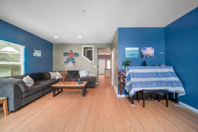 Living room with baseboards, wood finished floors, and recessed lighting | Image 24