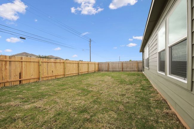 View of fenced backyard | Image 33