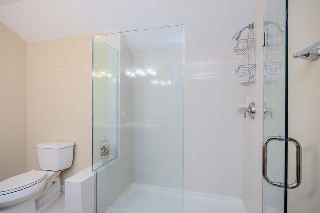 Bathroom with toilet and a shower stall | Image 23