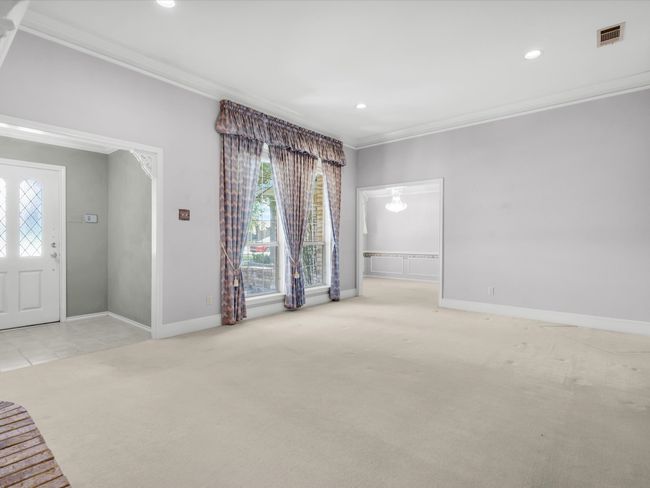 Large foyer area leads to the bright living room. | Image 7