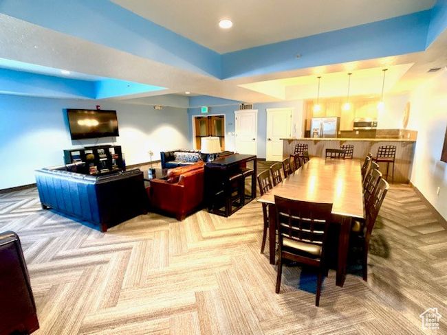 Dining area featuring carpet, a raised ceiling, and recessed lighting | Image 16