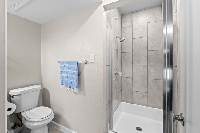 The shower was renovated with a beautiful, updated tile. | Image 25