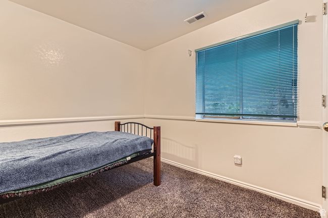 Bedroom featuring carpet floors and baseboards | Image 22