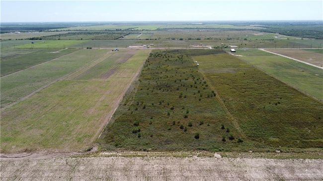 Aerial view of property's location with rural landscape and large plots for crops | Image 4