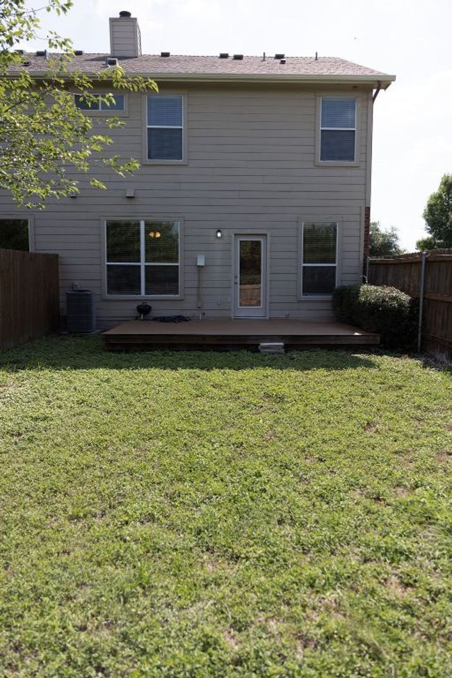 Back of house featuring a wooden deck, and a chimney | Image 11