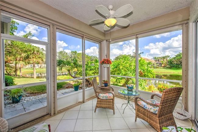 Sunroom featuring a ceiling fan and a water view | Image 4