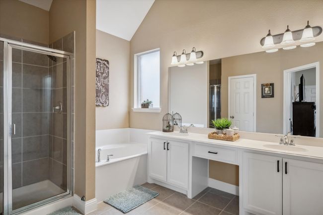 Full bath with tile patterned flooring, a sink, and a shower stall | Image 18