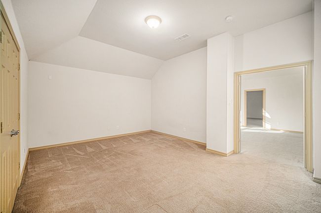 Bonus room featuring carpet, vaulted ceiling, and baseboards | Image 24