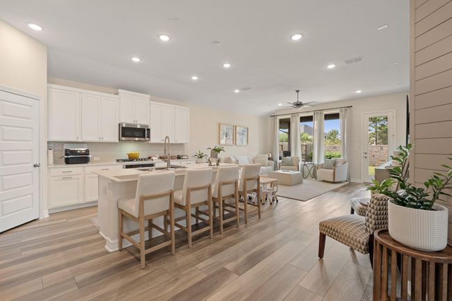 The gourmet kitchen has additional seating at the breakfast bar. A great home for entertaining friends and or family. | Image 8