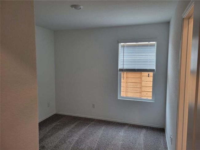 Spare room featuring carpet floors and plenty of natural light | Image 26