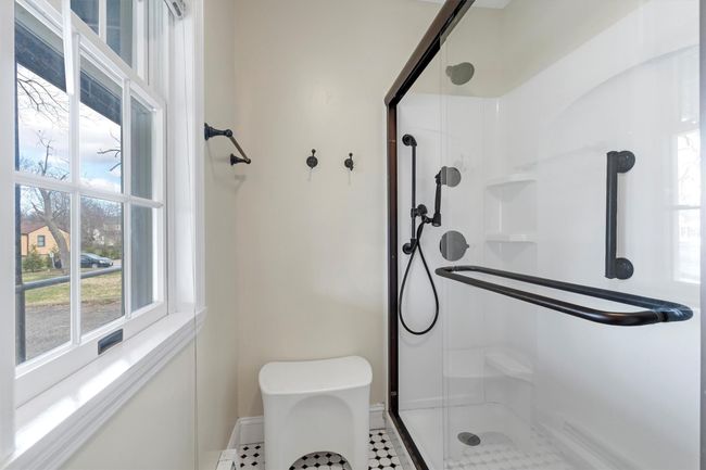Bathroom with a stall shower and baseboards | Image 30