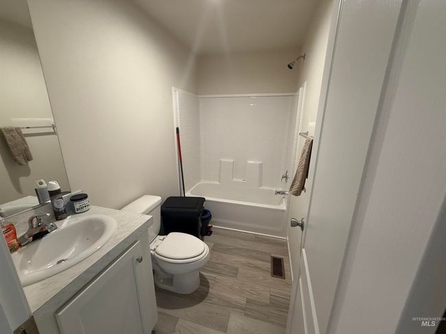 Full bathroom featuring vanity and tub / shower combination | Image 17