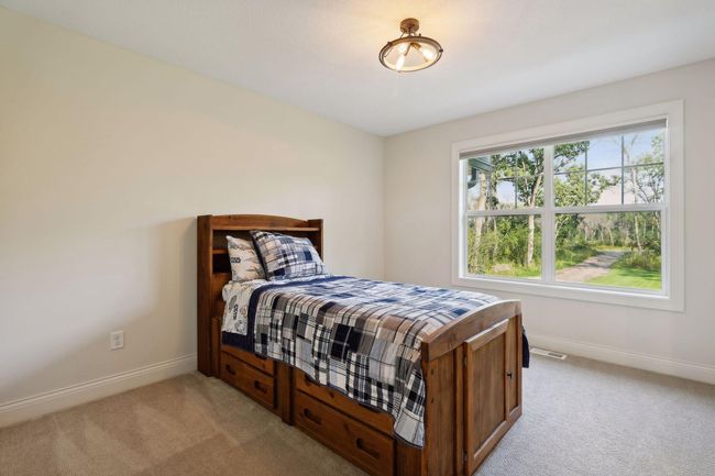 One of four bedrooms located on the Upper Level | Image 35