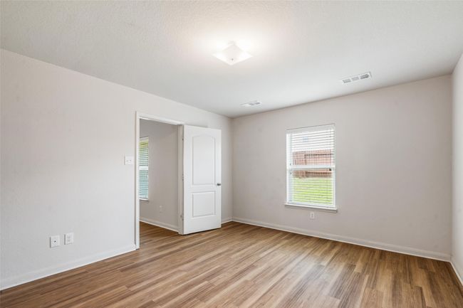 Unfurnished room with light wood-type flooring and baseboards | Image 12