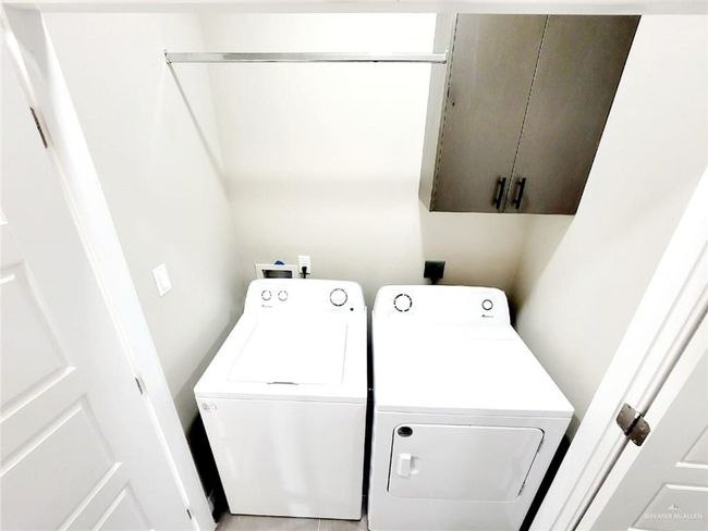 Laundry area with cabinet space and washer and dryer | Image 6