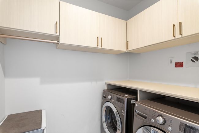 Washroom with independent washer and dryer and cabinet space | Image 16