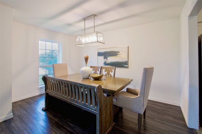 Dining room featuring dark wood finished floors | Image 7