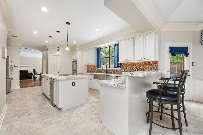 From morning coffee to evening conversations, this open-concept kitchen and breakfast bar bring ease to everyday living. With granite countertops, a remodeled layout (2021), and updated appliances, it’s a space that looks beautiful and lives even better. | Image 20