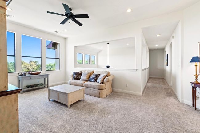 The expansive bonus room is a great place to play games or enjoy your favorite hobby. | Image 18