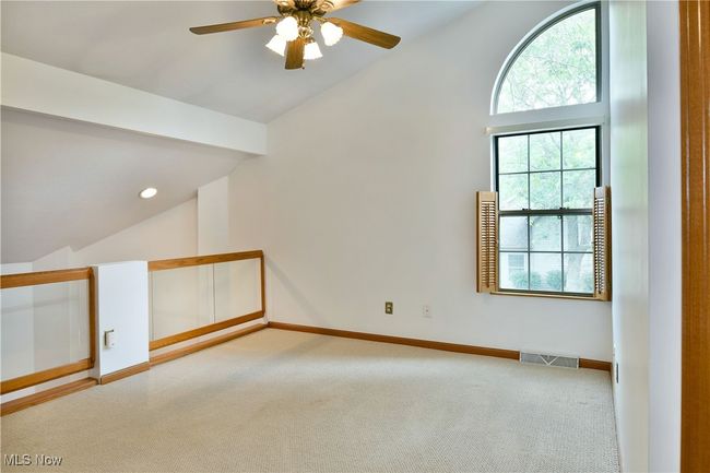 Additional living space with lofted ceiling, carpet floors, and ceiling fan | Image 24