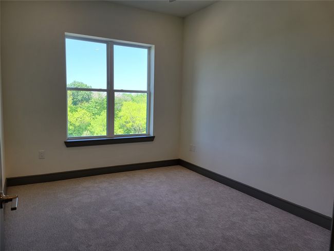 Carpeted spare room with baseboards | Image 10