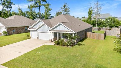 Craftsman-style home featuring a garage and a front yard | Image 3