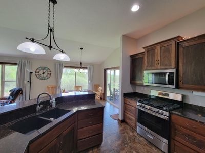 Kitchen island and stainless steel appliances | Image 3