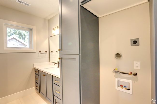 Bathroom featuring vanity and tile patterned floors | Image 21