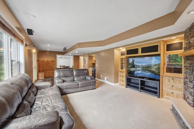 Downstairs entertainment area with another gas fireplace and wet bar | Image 21