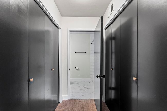 Hall featuring marble finish floors and baseboards | Image 18