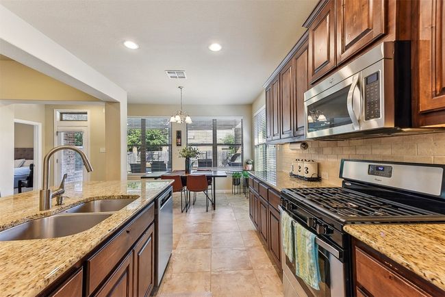 Whether you're meal prepping or hosting, the walk-in pantry and thoughtful storage make this kitchen as practical as it is beautiful | Image 13