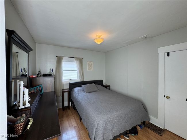First floor bedroom with wood finished floors | Image 18