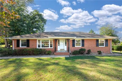 Ranch-style home featuring a front yard | Image 1