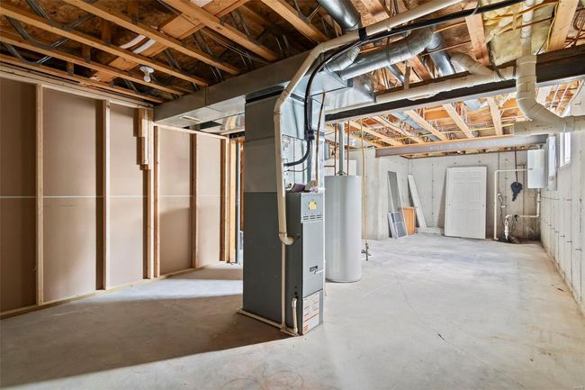 Finished basement with visible vents, baseboards, recessed lighting, and light wood-style floors | Image 25