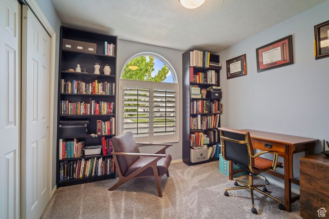 Carpeted home office with a textured ceiling and baseboards | Image 17