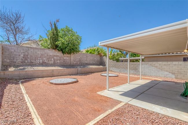 Fenced backyard featuring a patio area | Image 31