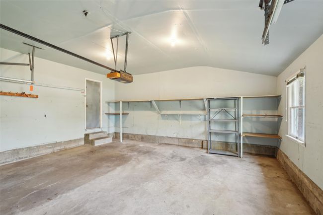 Garage featuring a garage door opener | Image 28