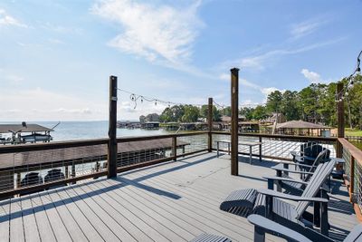 Enjoy panoramic lake views as you relax on the sun deck, whether you're savoring a meal, soaking up the sun, or unwinding in style | Image 1