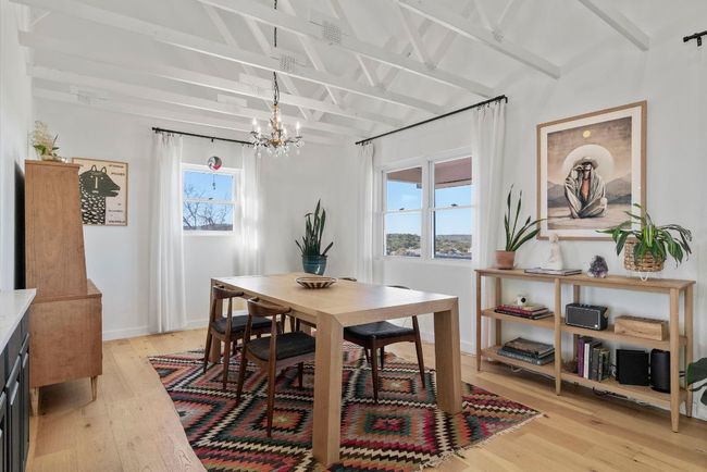 Dining space featuring natural light, chandelier, and vaulted ceilings | Image 8