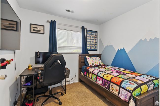 Carpeted bedroom featuring visible vents | Image 32