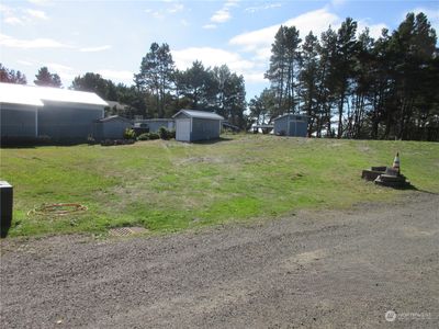 Wider view showing transformer and well head in foreground. | Image 2