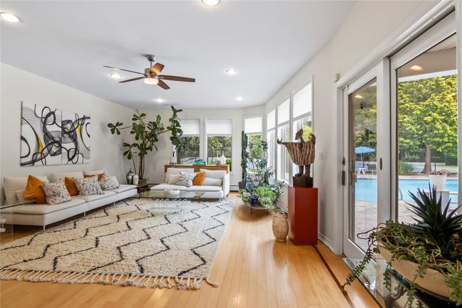 Living area featuring ceiling fan, wood-type flooring, and recessed lighting | Image 16