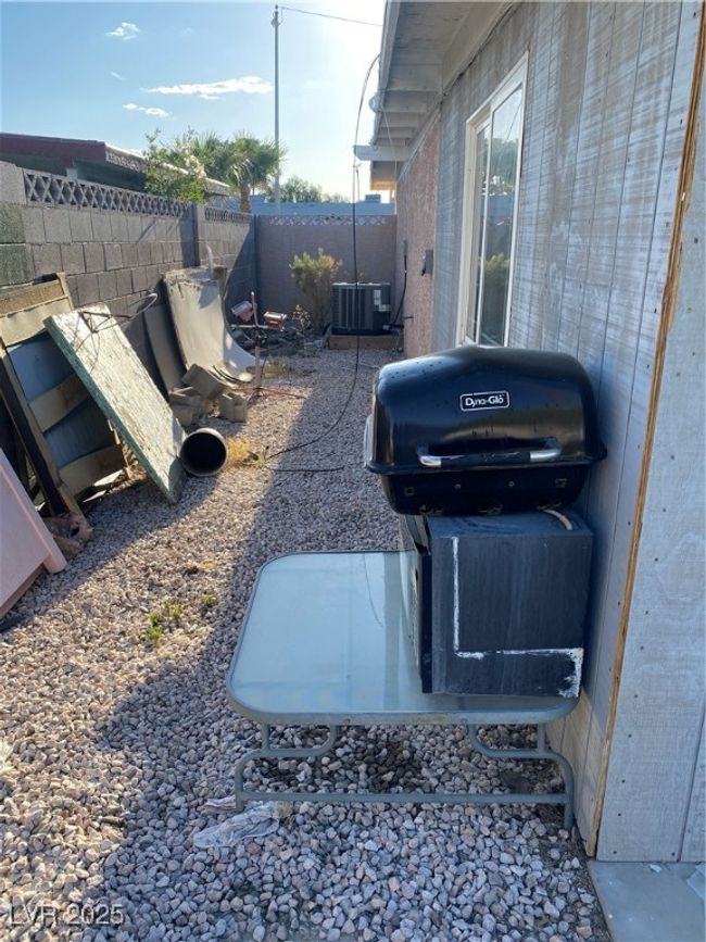 View of yard with a fenced backyard and cooling unit | Image 24