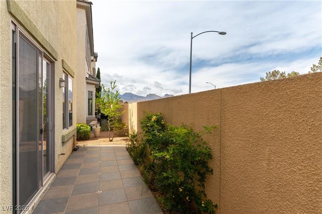 View of patio with fence | Image 34
