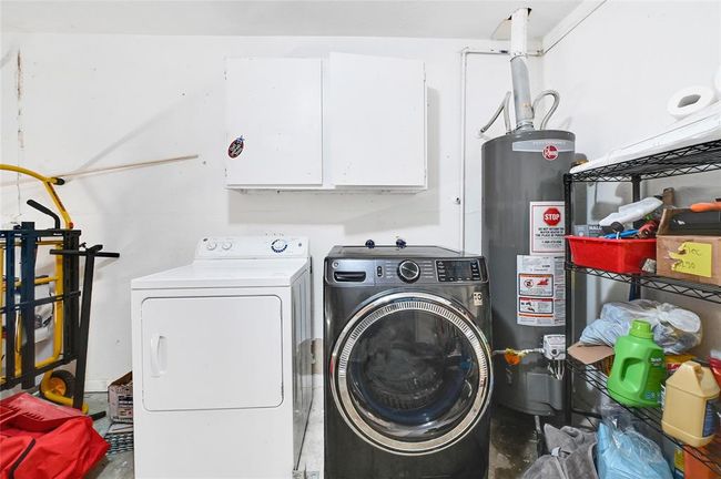 Convenient in-garage laundry area. | Image 10